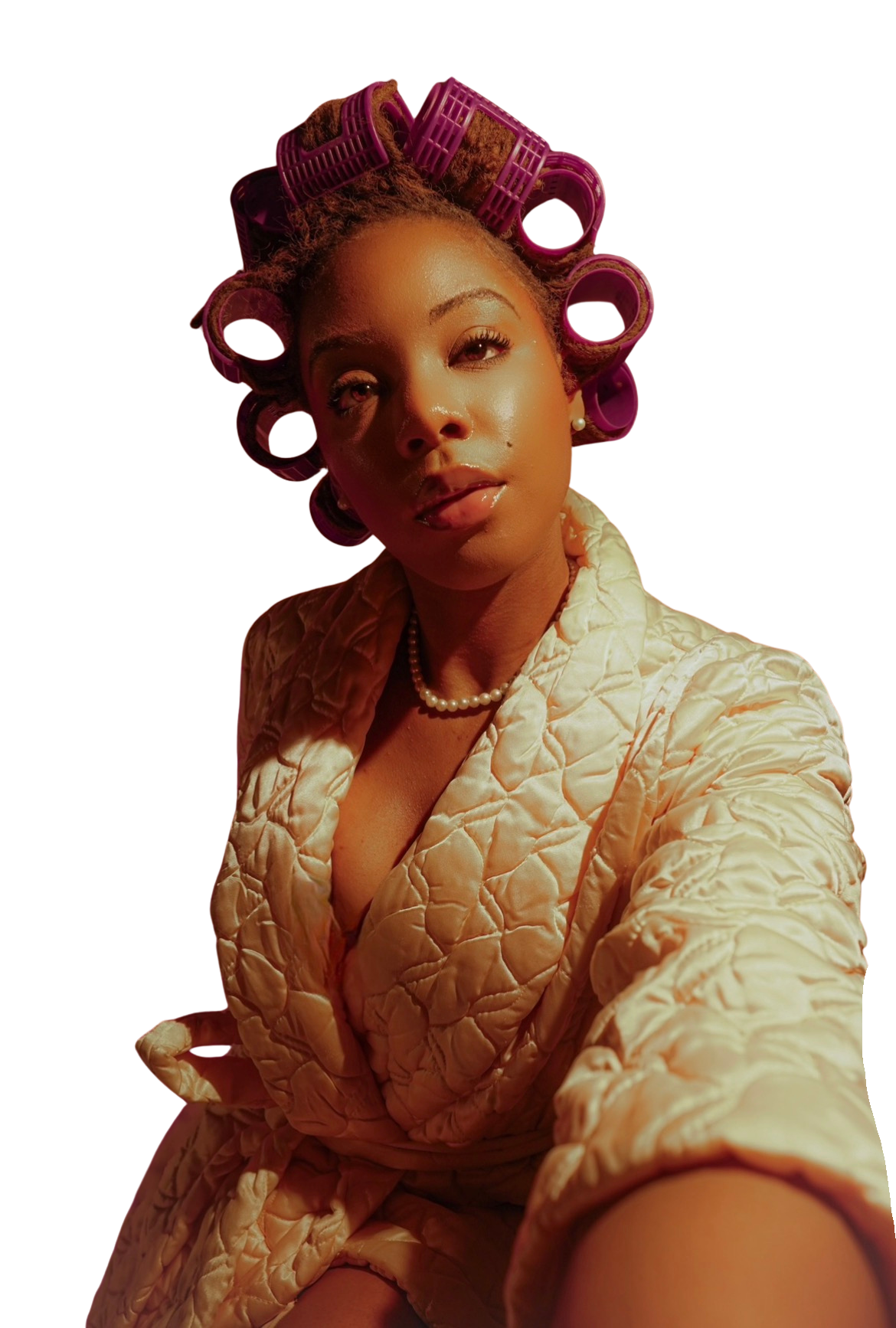 Hannah in hair rollers and a quilted gold jacket